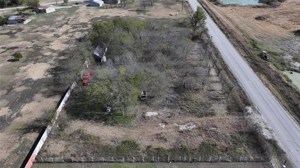 5601 Bilindsay Road Seagoville, TX 75159 - Photo 4 of 12 a view of a dry yard with wooden fence