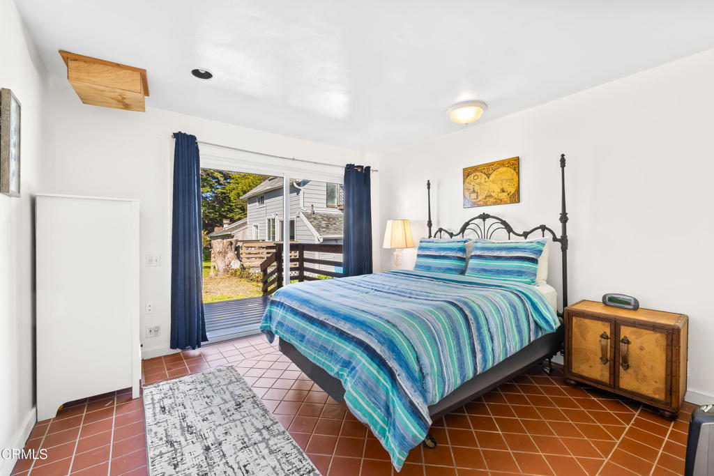 1990 Highway 1 Albion, CA 95410 - Photo 26 of 57 a bedroom with a bed and wooden floor