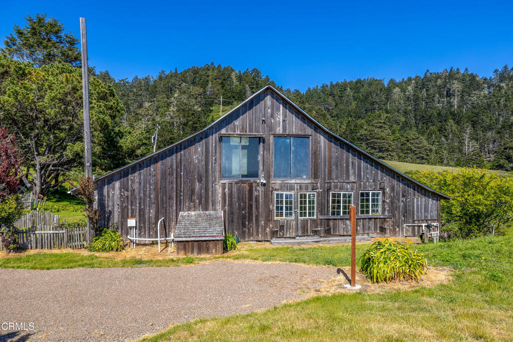 1990 Highway 1 Albion, CA 95410 - Photo 45 of 57 a view of a house with backyard and trees