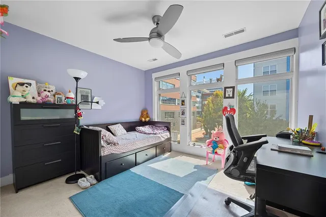 a bedroom with a workspace