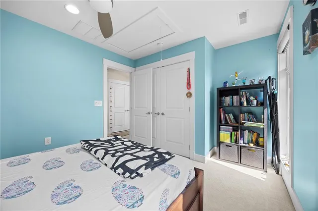 a bedroom with a bed and a cabinets