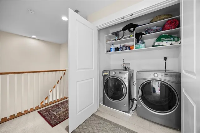 a view of a hallway with washer and dryer