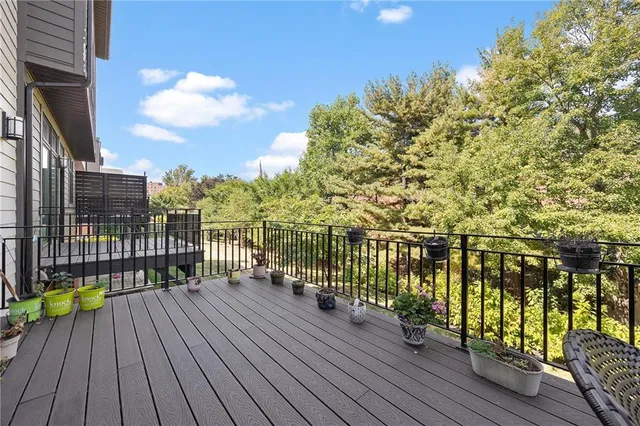 a view of a balcony with wooden floor