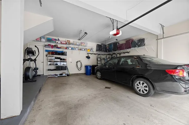 a view of parking garage with cars