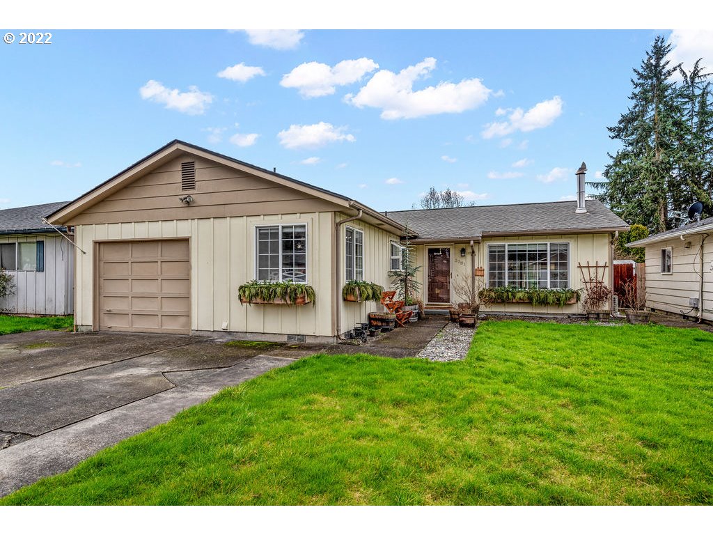 a front view of house with yard and green space