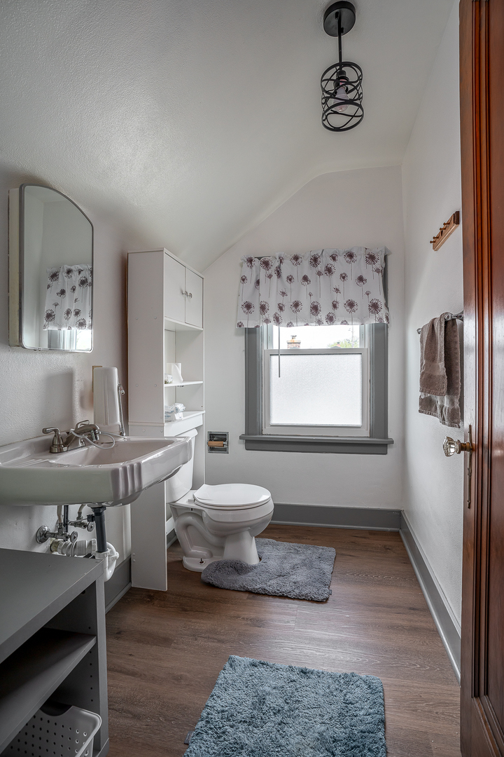 414 45th Street Moline, IL 61265 - Photo 13 of 13 a bathroom with a toilet sink and mirror