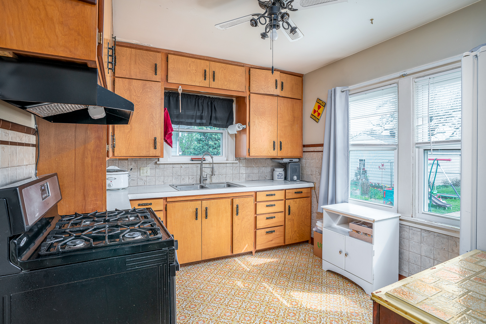414 45th Street Moline, IL 61265 - Photo 4 of 13 a kitchen with stainless steel appliances a sink stove and cabinets