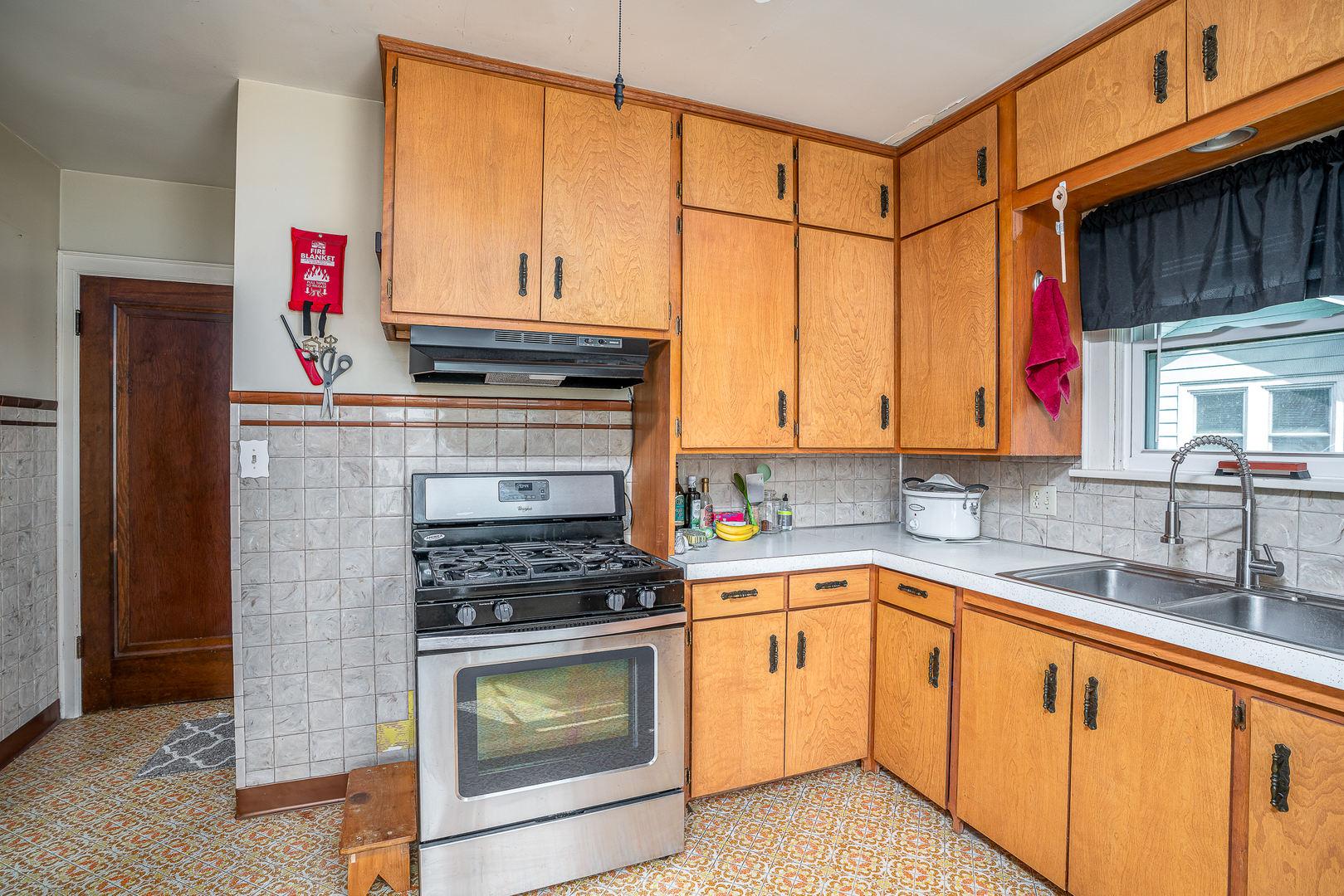 414 45th Street Moline, IL 61265 - Photo 5 of 13 a kitchen with stainless steel appliances granite countertop a stove a sink and a microwave