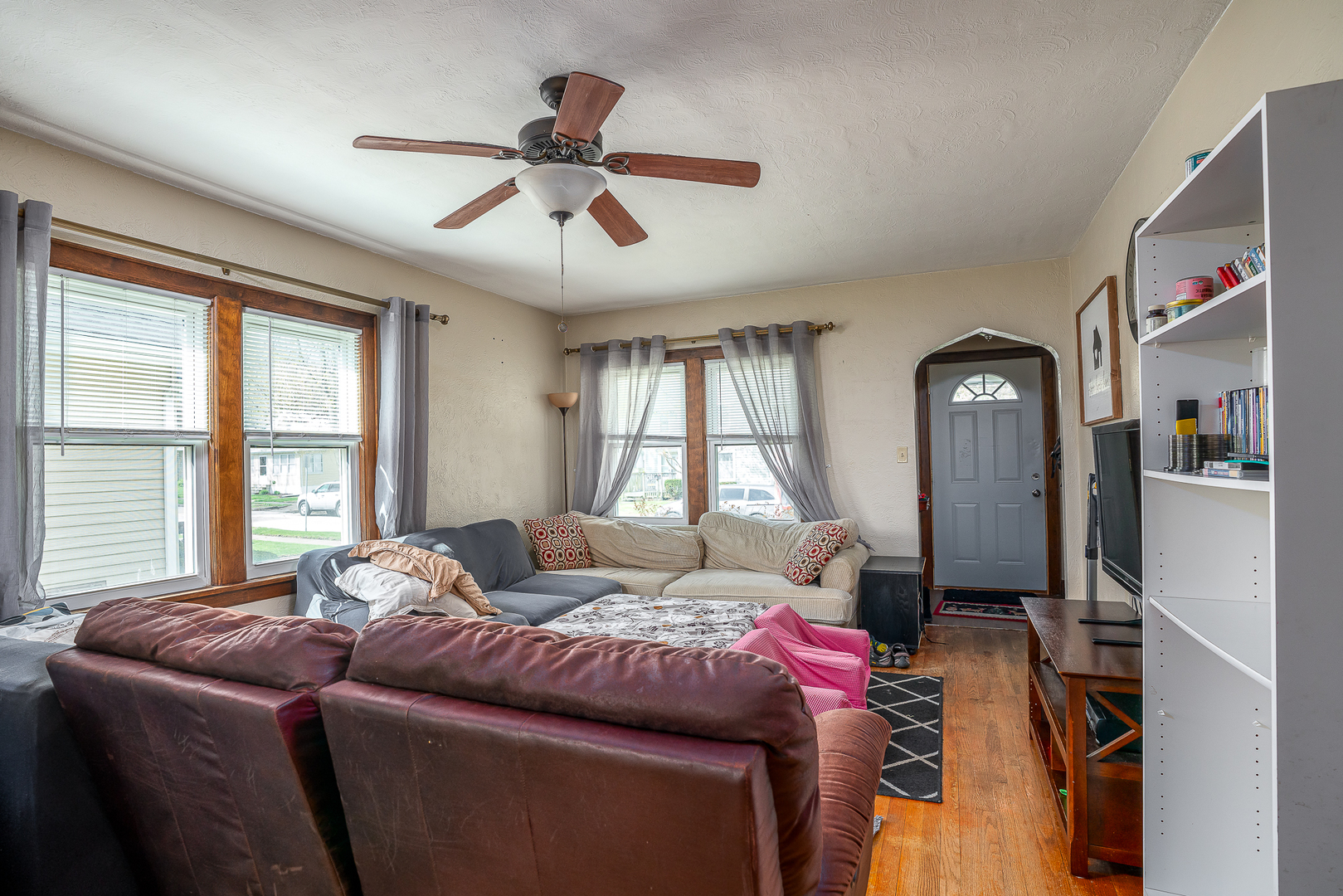 414 45th Street Moline, IL 61265 - Photo 7 of 13 a living room with a bed and a large window