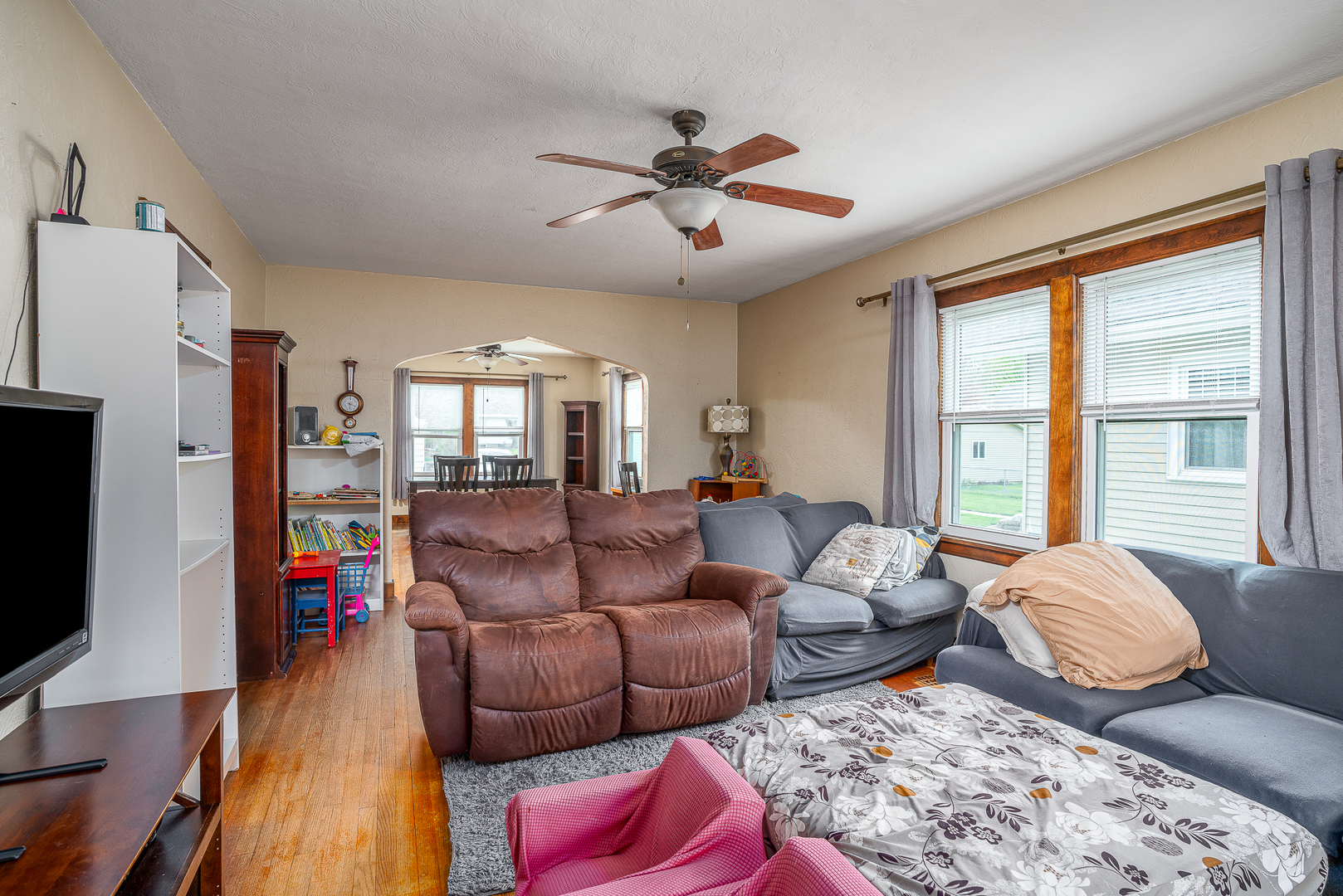 414 45th Street Moline, IL 61265 - Photo 8 of 13 a living room with furniture and a flat screen tv