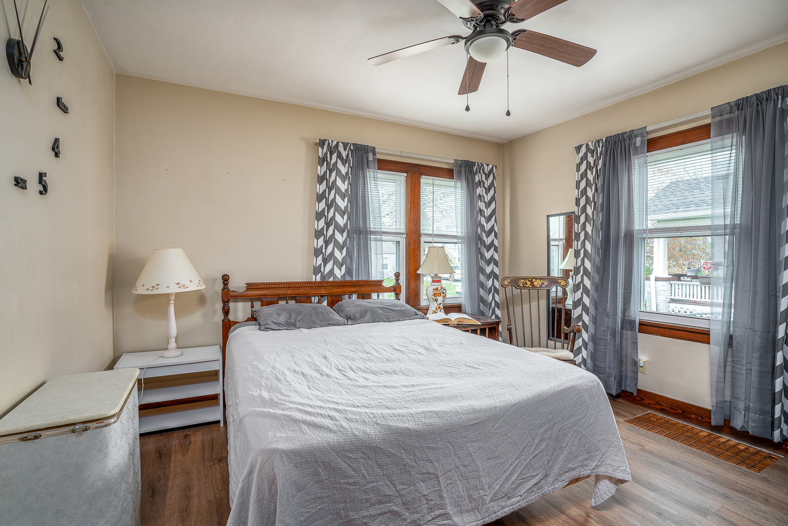 414 45th Street Moline, IL 61265 - Photo 9 of 13 a bedroom with a bed and a chandelier