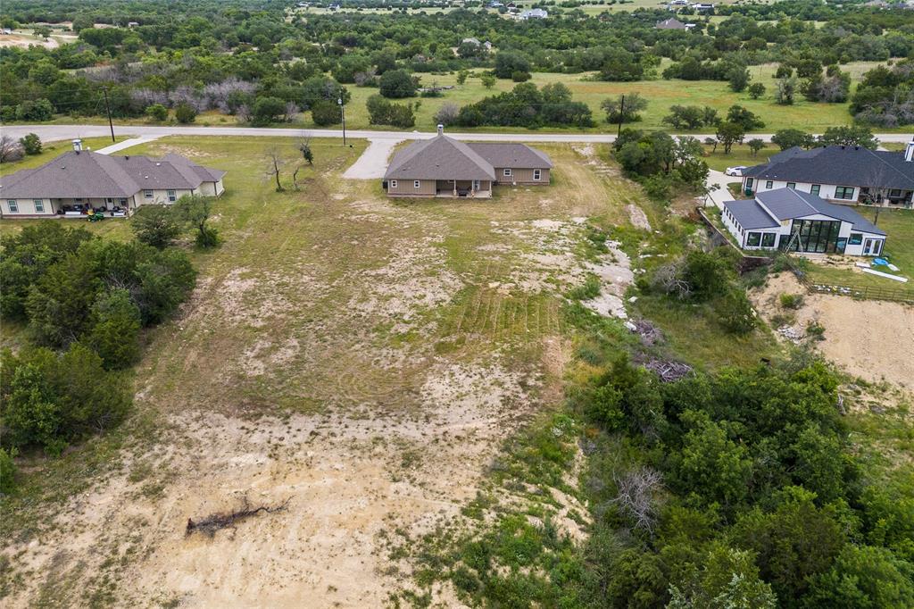 139 Kriston Lane Springtown, TX 76082 - Photo 36 of 39 Expansive lot featuring undeveloped land with surrounding mature trees and natural landscaping