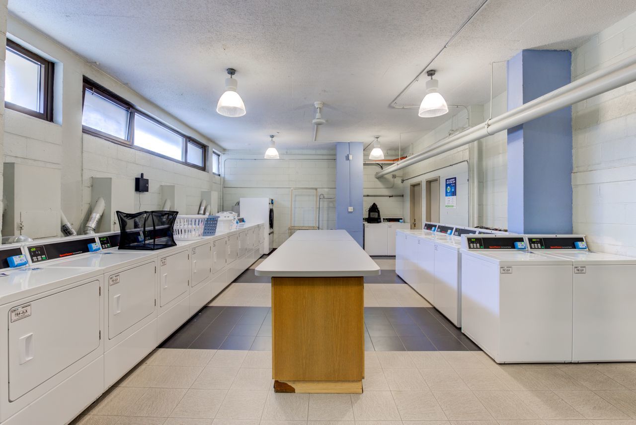 2930 North Sheridan Road, Unit 1010 Chicago, IL 60657 - Photo 20 of 24 a large white kitchen with lots of counter space