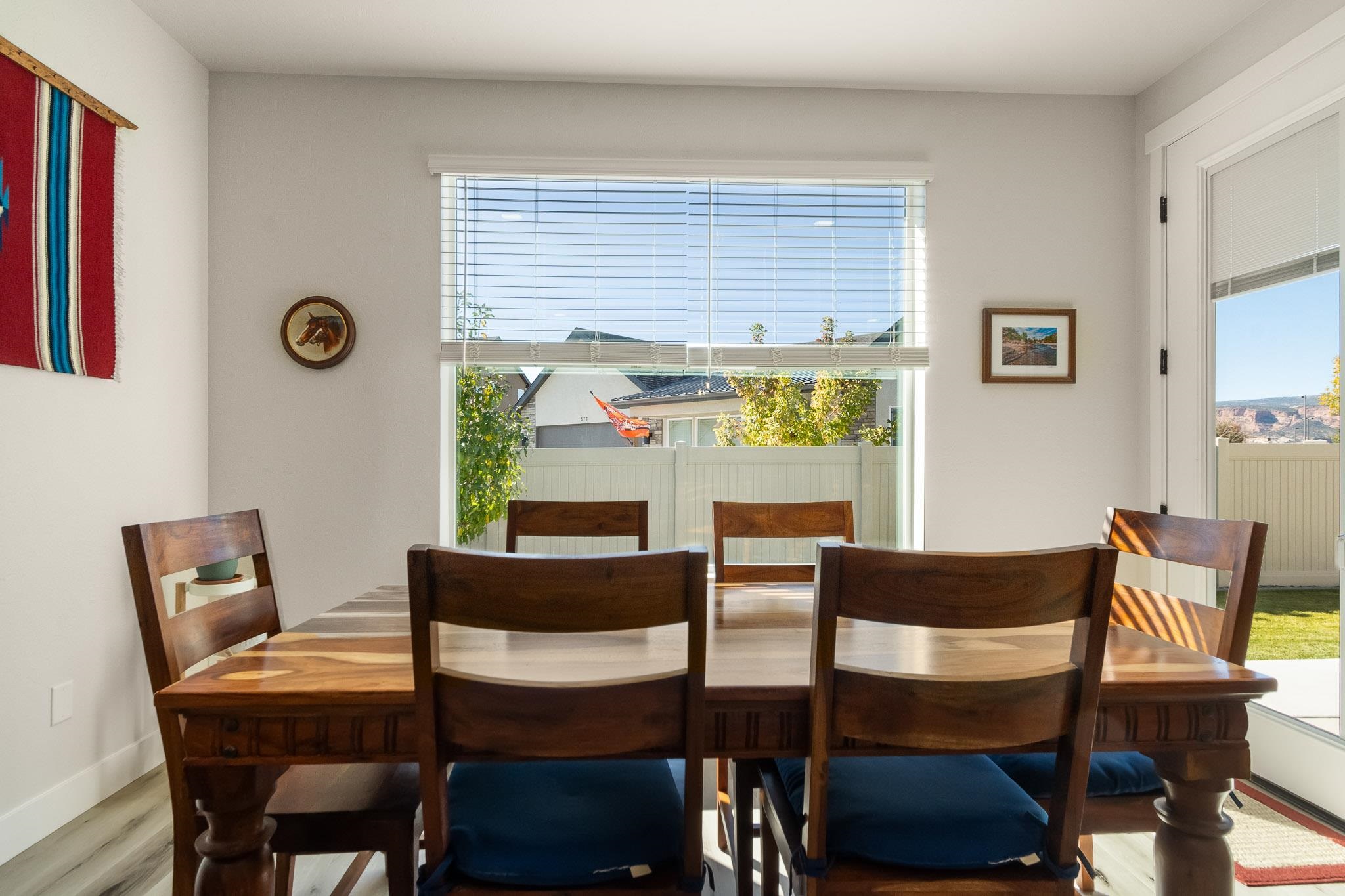 559 Hobbs Court Fruita, CO 81521 - Photo 13 of 40 a view of a dining room with furniture and a window