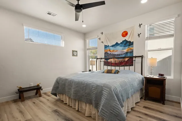 a bedroom with a bed and a table in it