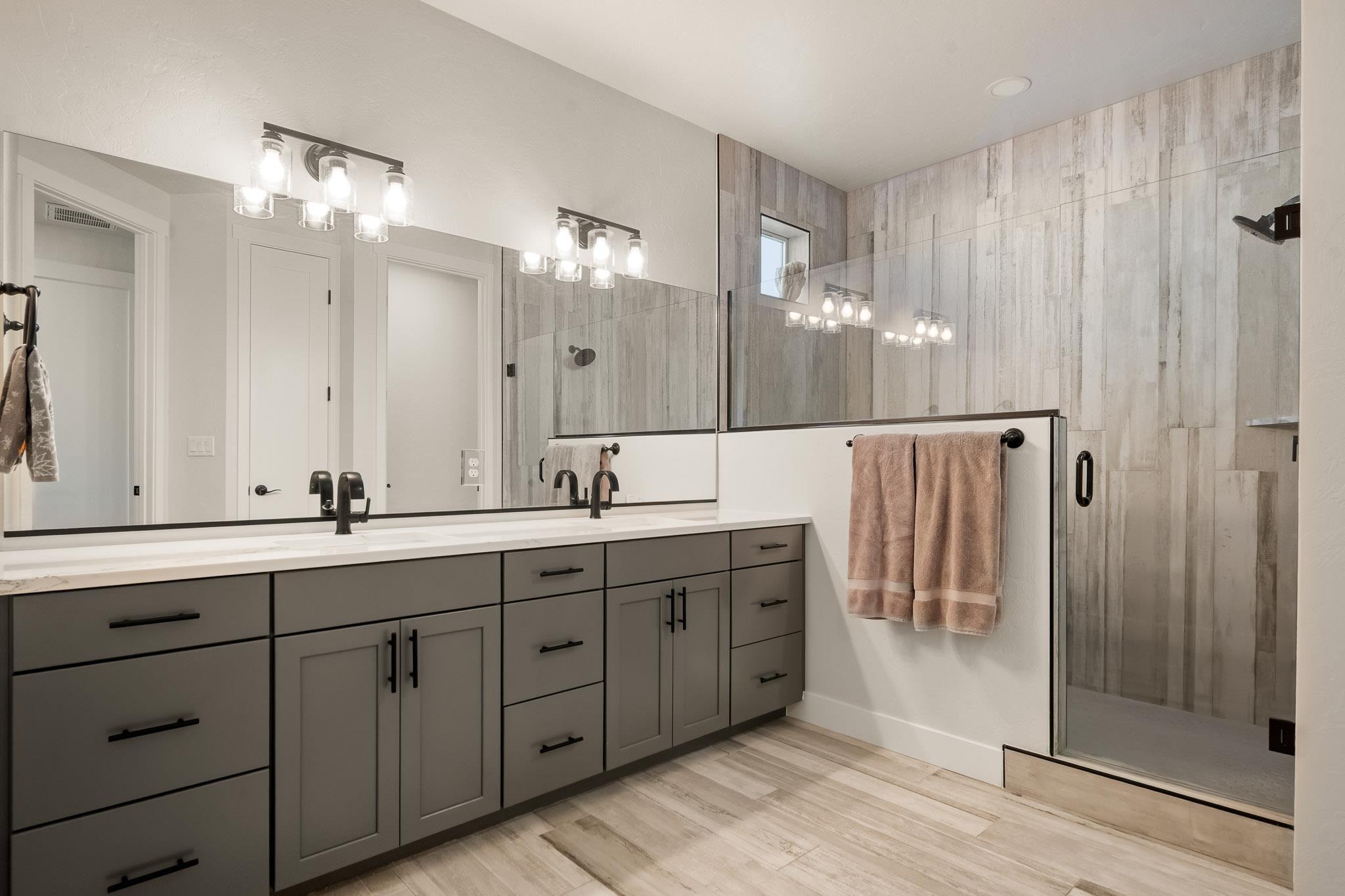 559 Hobbs Court Fruita, CO 81521 - Photo 17 of 40 a spacious bathroom with double vanity and a mirror