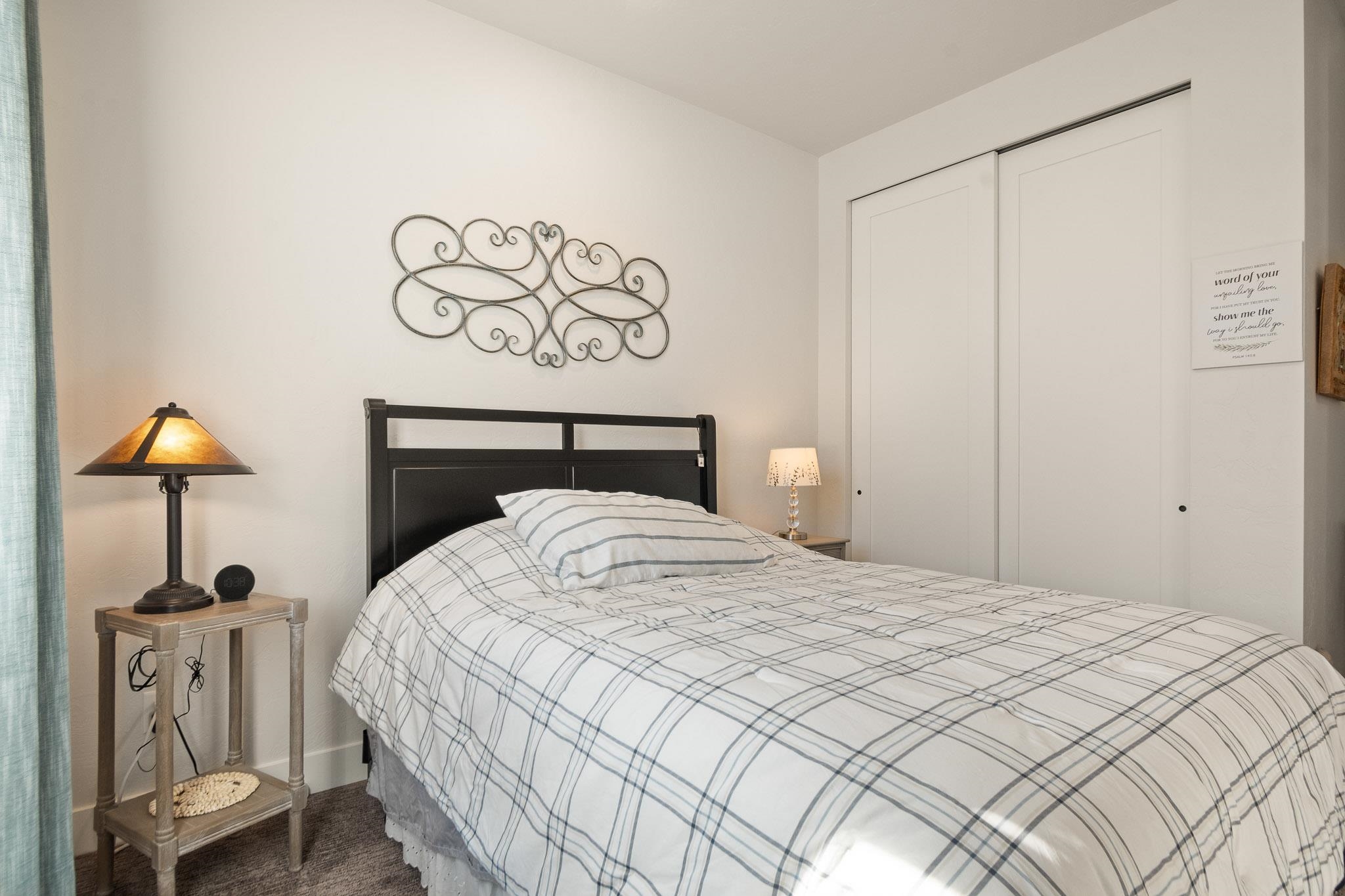 559 Hobbs Court Fruita, CO 81521 - Photo 18 of 40 a bedroom with a bed and a table in it