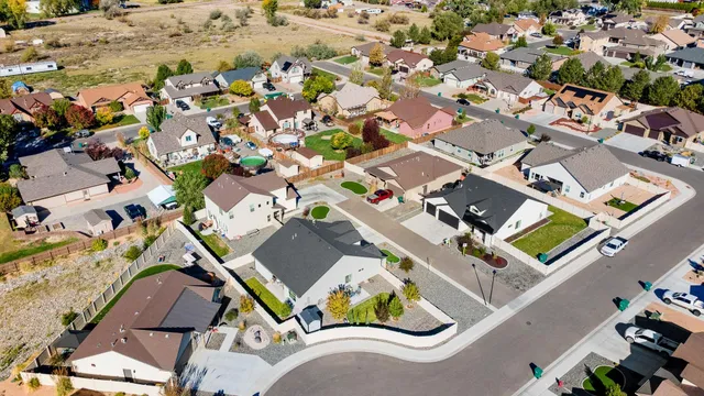 an aerial view of residential houses with outdoor space
