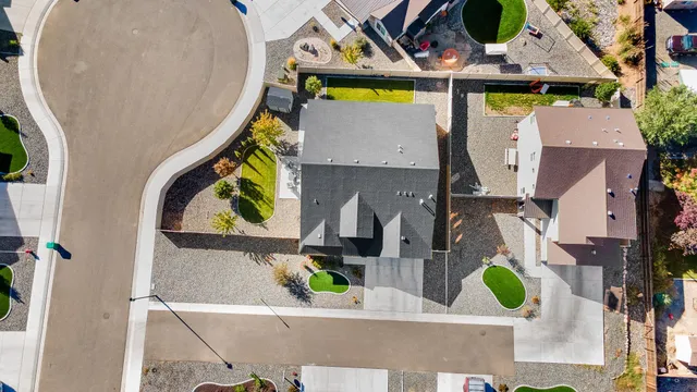 an aerial view of a house with outdoor space