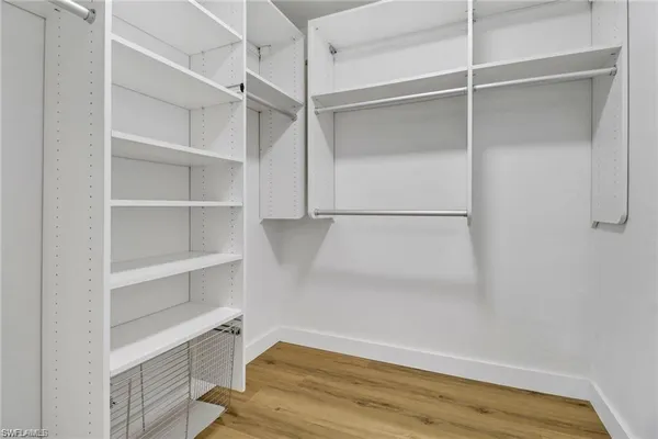 a view of an empty walk in closet