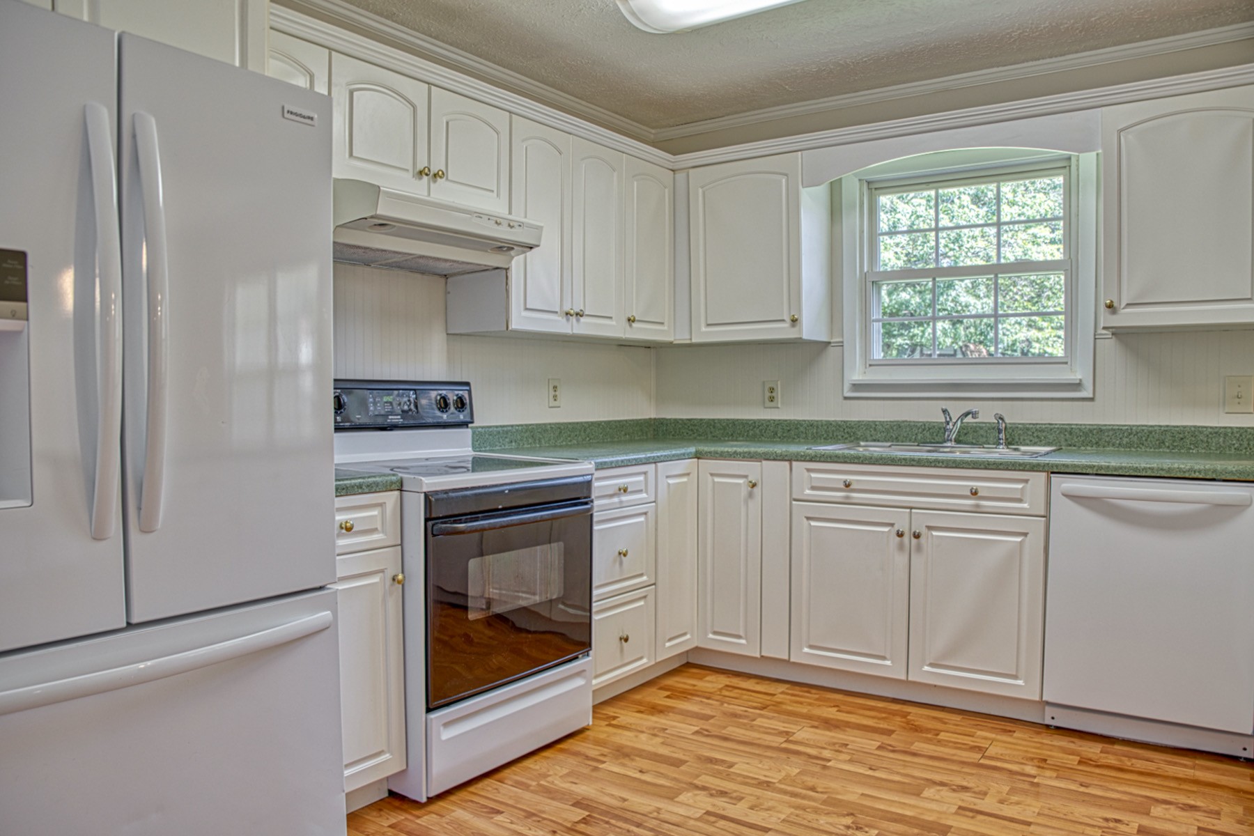 2085 Herbert Garrett Road Cookeville, TN 38506 - Photo 20 of 39 a kitchen with granite countertop white cabinets stainless steel appliances and a sink