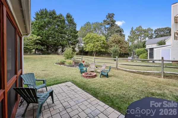 a view of a livingroom with furniture and stairs