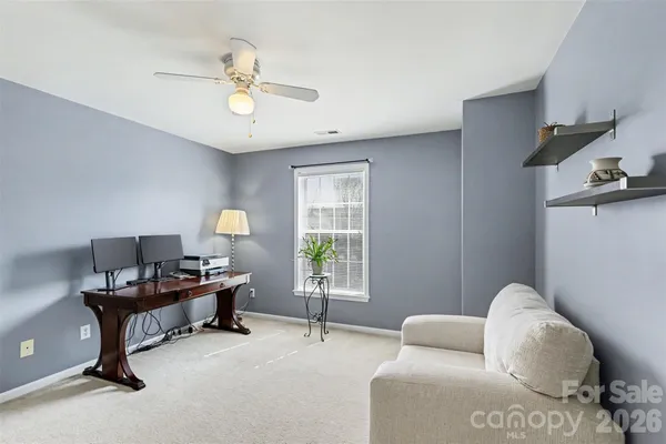 a view of livingroom with workspace