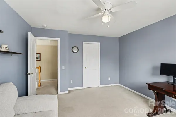 a bathroom with a toilet a sink and a window