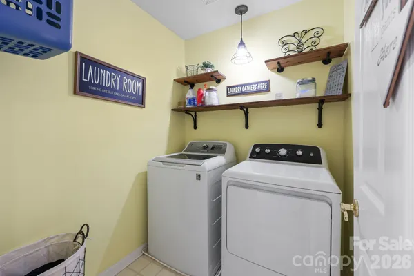 a bedroom with a bed next to a window