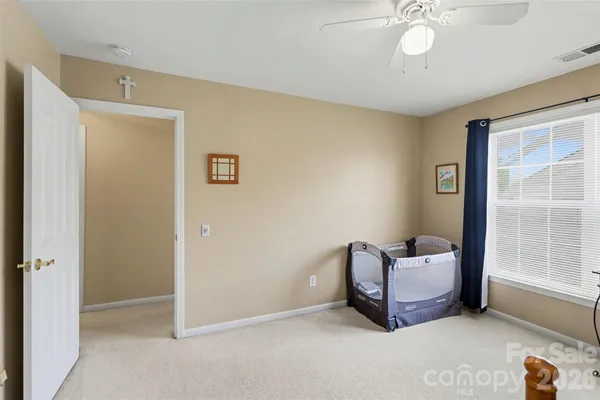 a view of a house with swimming pool and sitting area