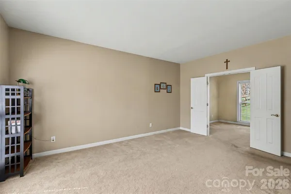 an empty room with furniture and closet