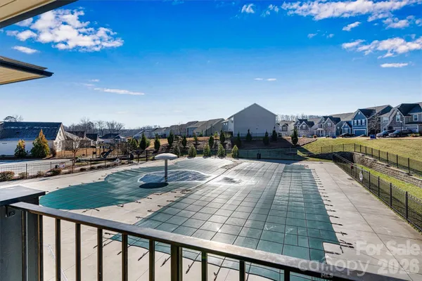 a view of a swimming pool with a patio
