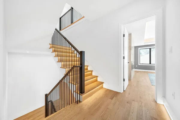 a bathroom with a bathtub shower sink vanity and toilet