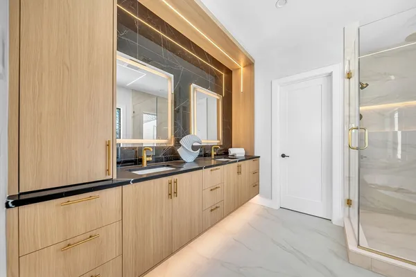 a bathroom with a double vanity sink and a mirror