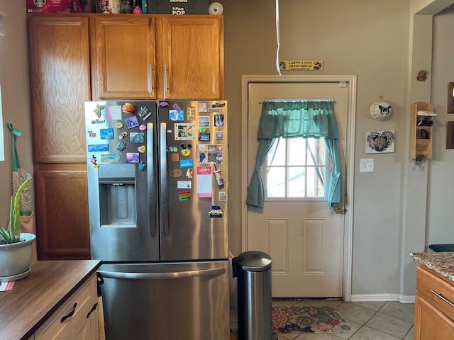 406 West 8th Street Brady, TX 76825 - Photo 12 of 33 a view of a refrigerator in kitchen and wooden floor