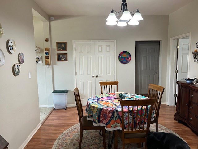 406 West 8th Street Brady, TX 76825 - Photo 13 of 33 a view of a dining room with furniture and wooden floor