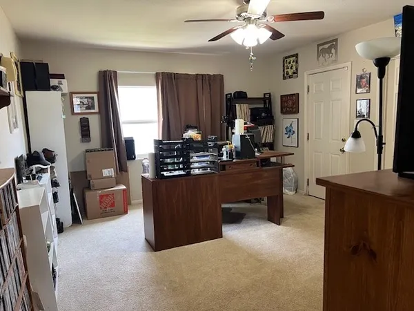 a kitchen with a refrigerator and a stove top oven