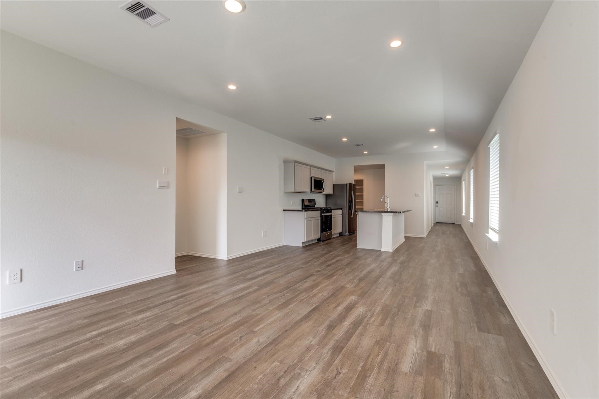 24323 Cayman Heights Lane Spring, TX 77373 - Photo 10 of 12 a view of kitchen and wooden floor