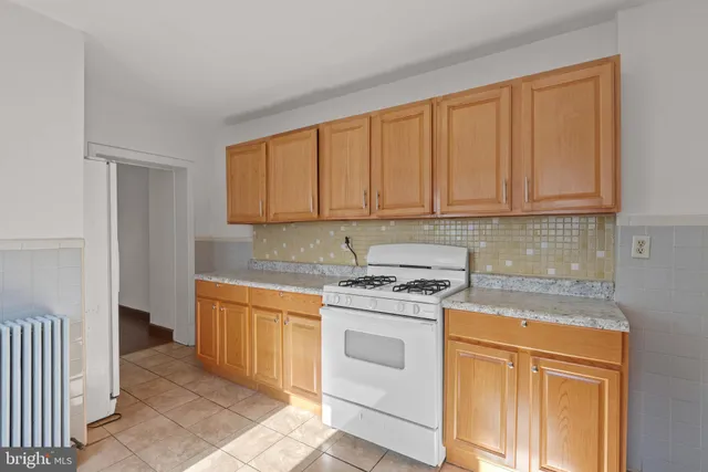 a view of a livingroom with wooden floor and a window