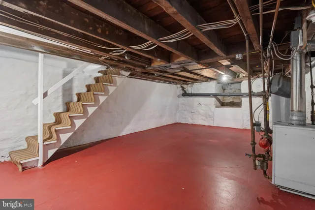 a view of empty room with wooden walls