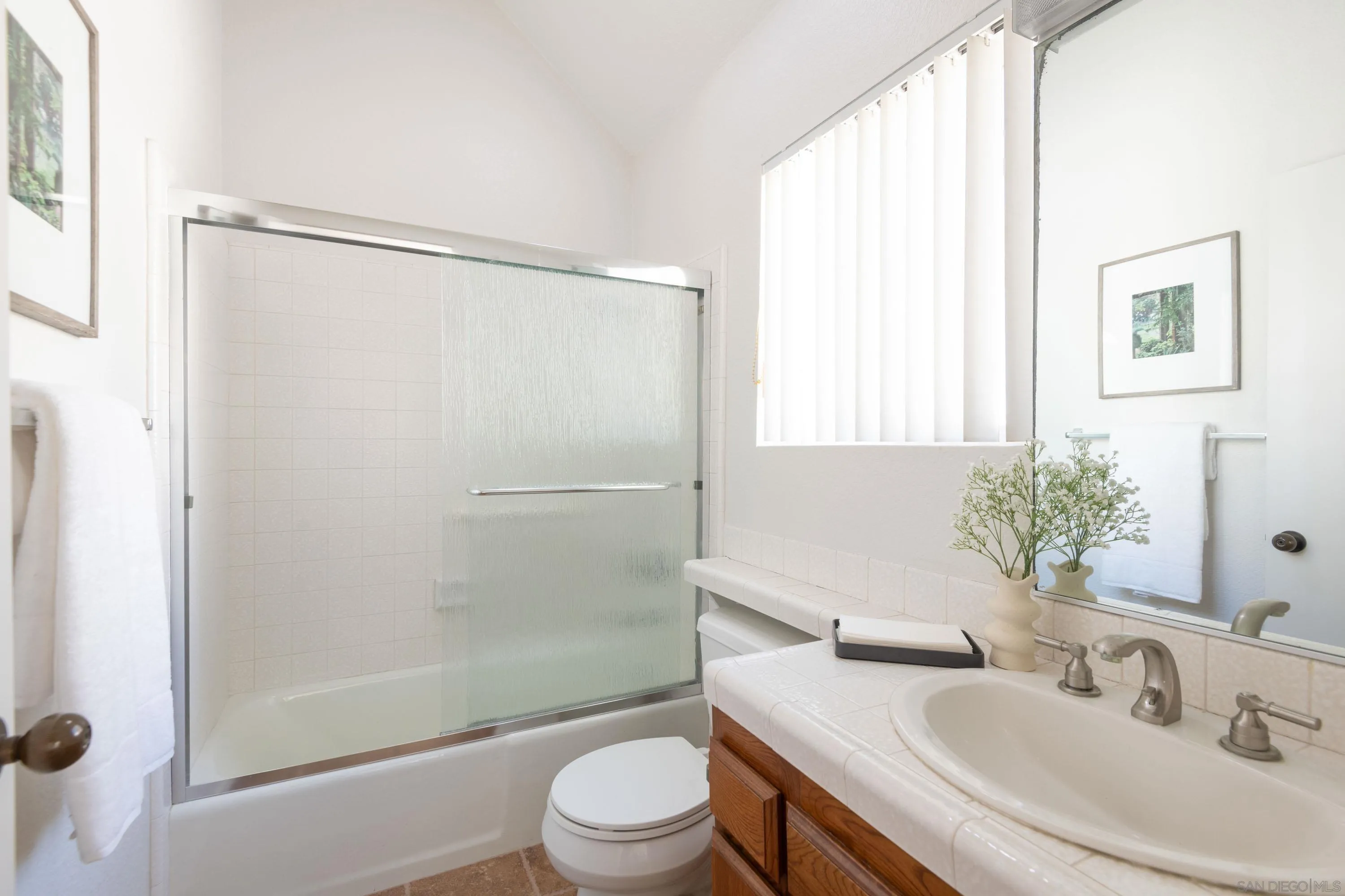 7585 Eads Avenue, Unit E La Jolla, CA 92037 - Photo 21 of 39 a bathroom with a sink toilet and shower