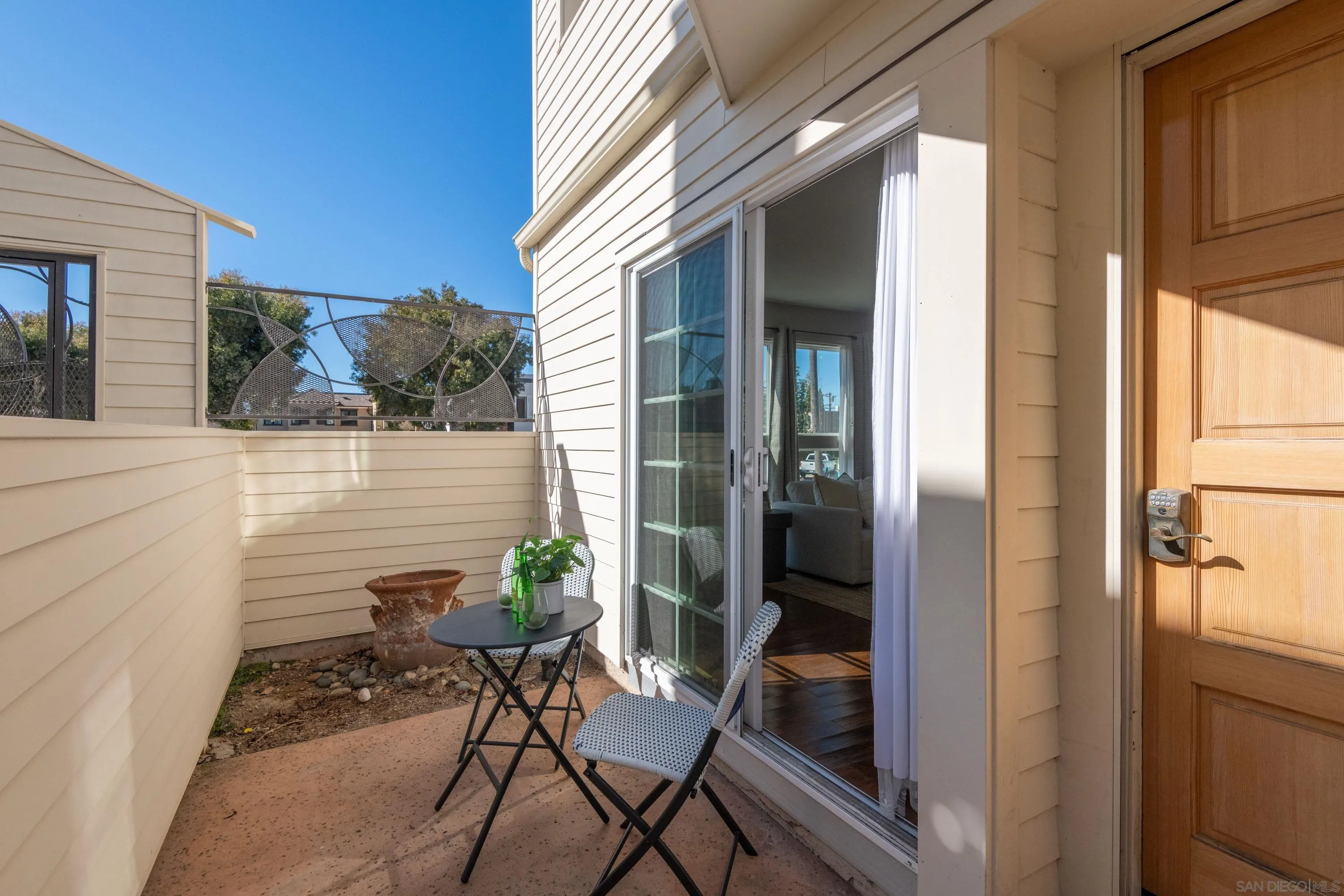 7585 Eads Avenue, Unit E La Jolla, CA 92037 - Photo 24 of 39 a view of a balcony with chairs and a potted plant
