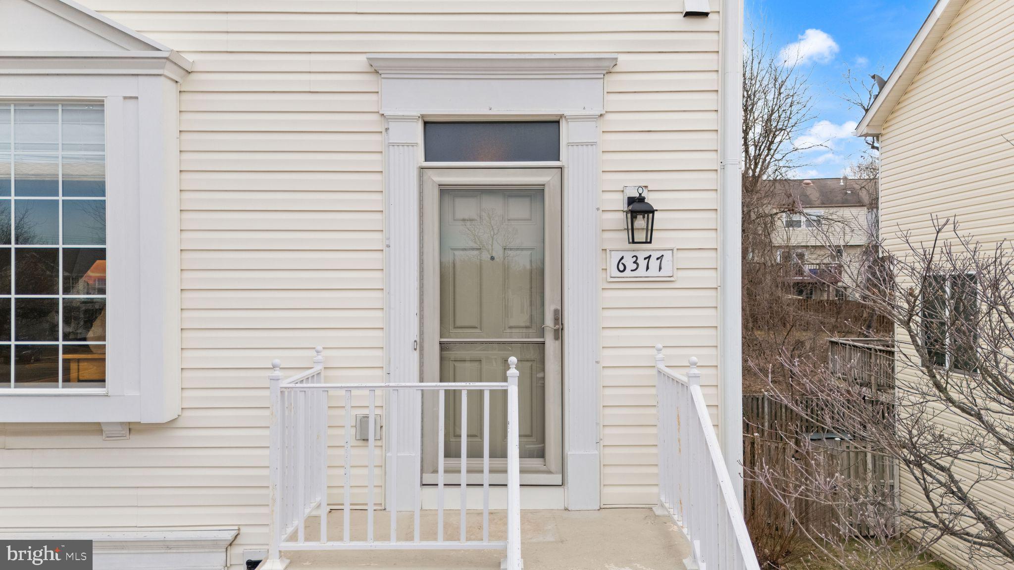 6377 St Timothys Lane Centreville, VA 20121 - Photo 11 of 58 a view of a wooden door of the house
