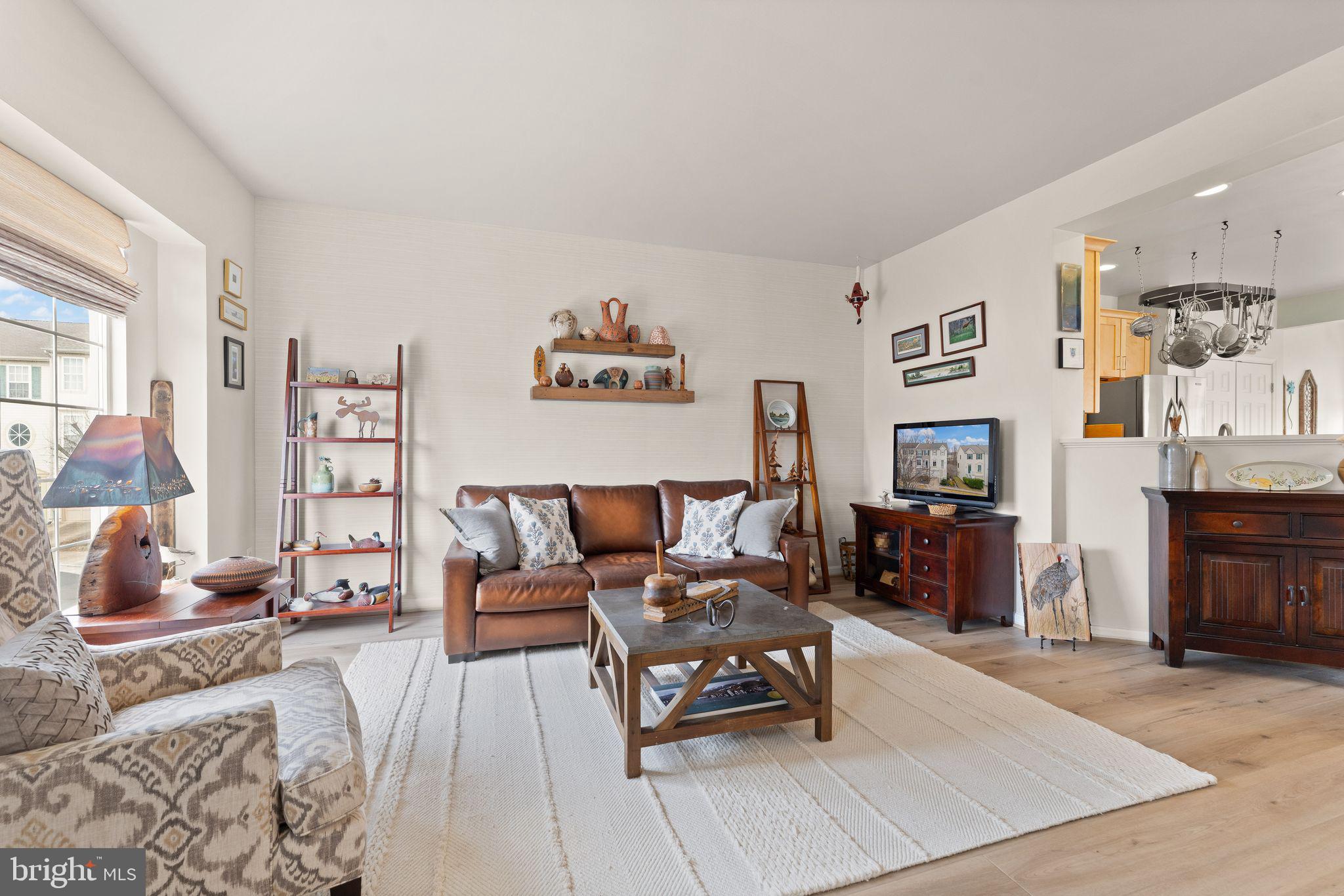 6377 St Timothys Lane Centreville, VA 20121 - Photo 15 of 58 a living room with furniture and a fireplace
