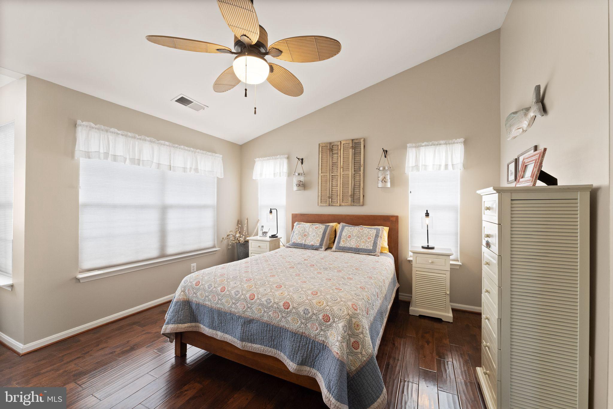 6377 St Timothys Lane Centreville, VA 20121 - Photo 31 of 58 a bedroom with a bed next to a window with a chandelier fan