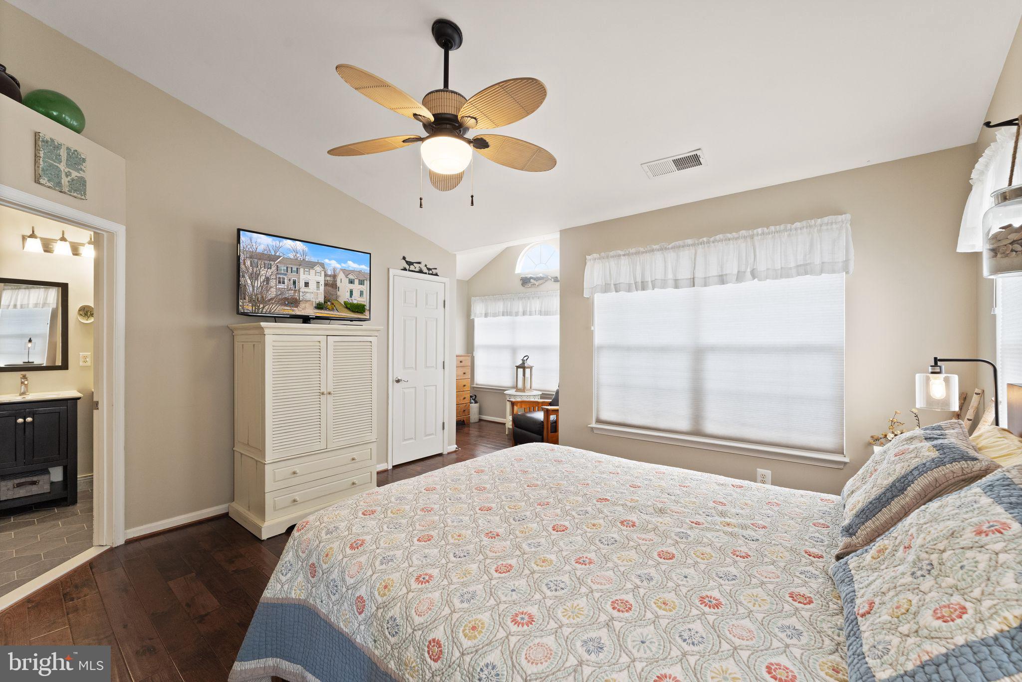 6377 St Timothys Lane Centreville, VA 20121 - Photo 33 of 58 a bedroom with a bed and a chandelier