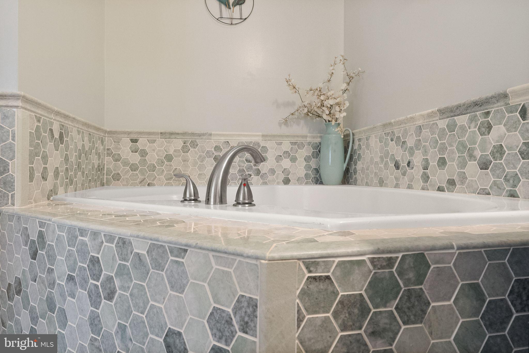 6377 St Timothys Lane Centreville, VA 20121 - Photo 36 of 58 a bathroom with a granite countertop sink and a mirror