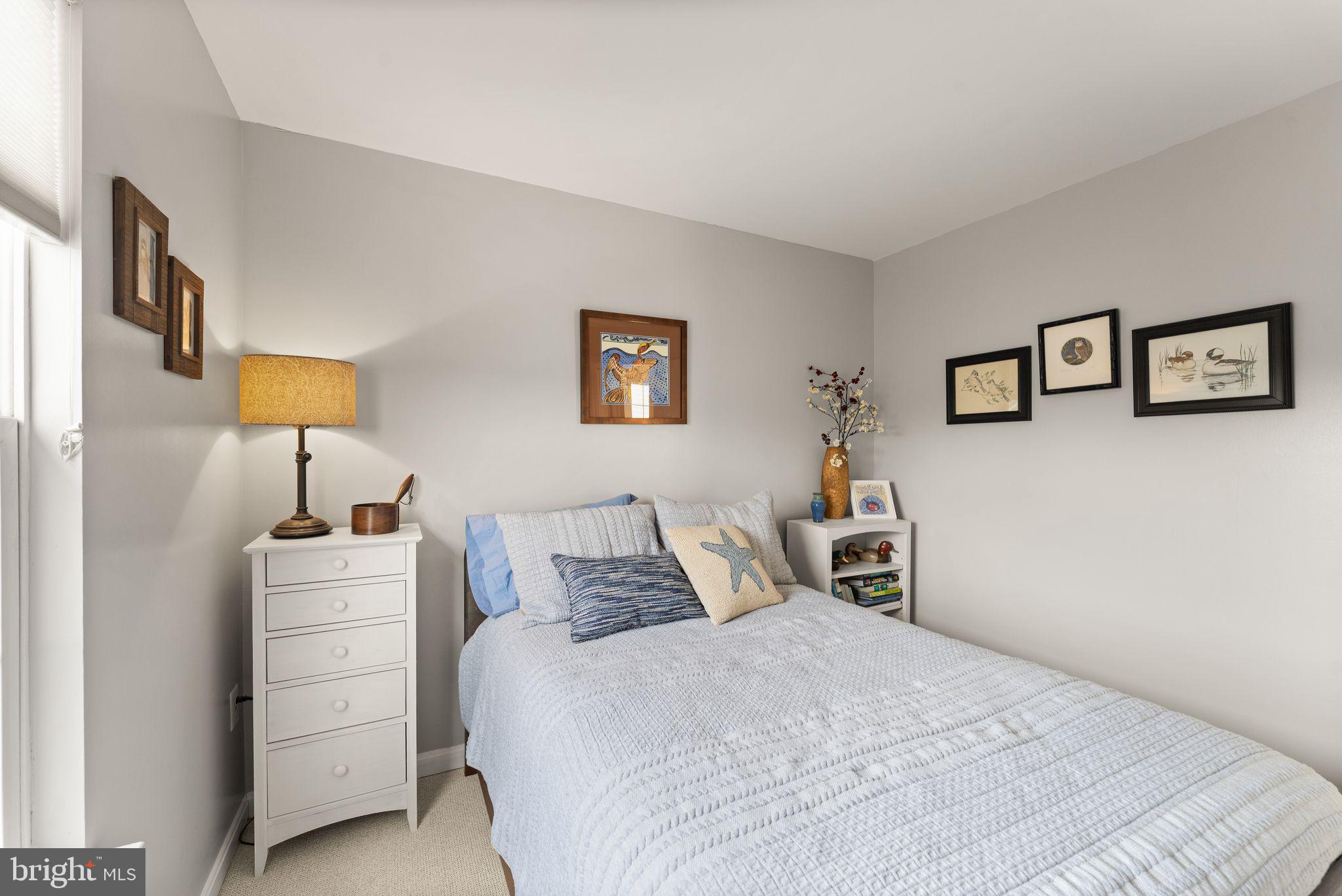 6377 St Timothys Lane Centreville, VA 20121 - Photo 41 of 58 a bedroom with a bed and a night stand