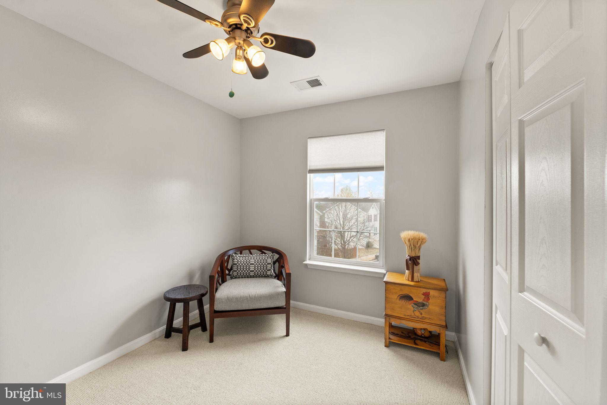 6377 St Timothys Lane Centreville, VA 20121 - Photo 42 of 58 a living room with furniture and a window