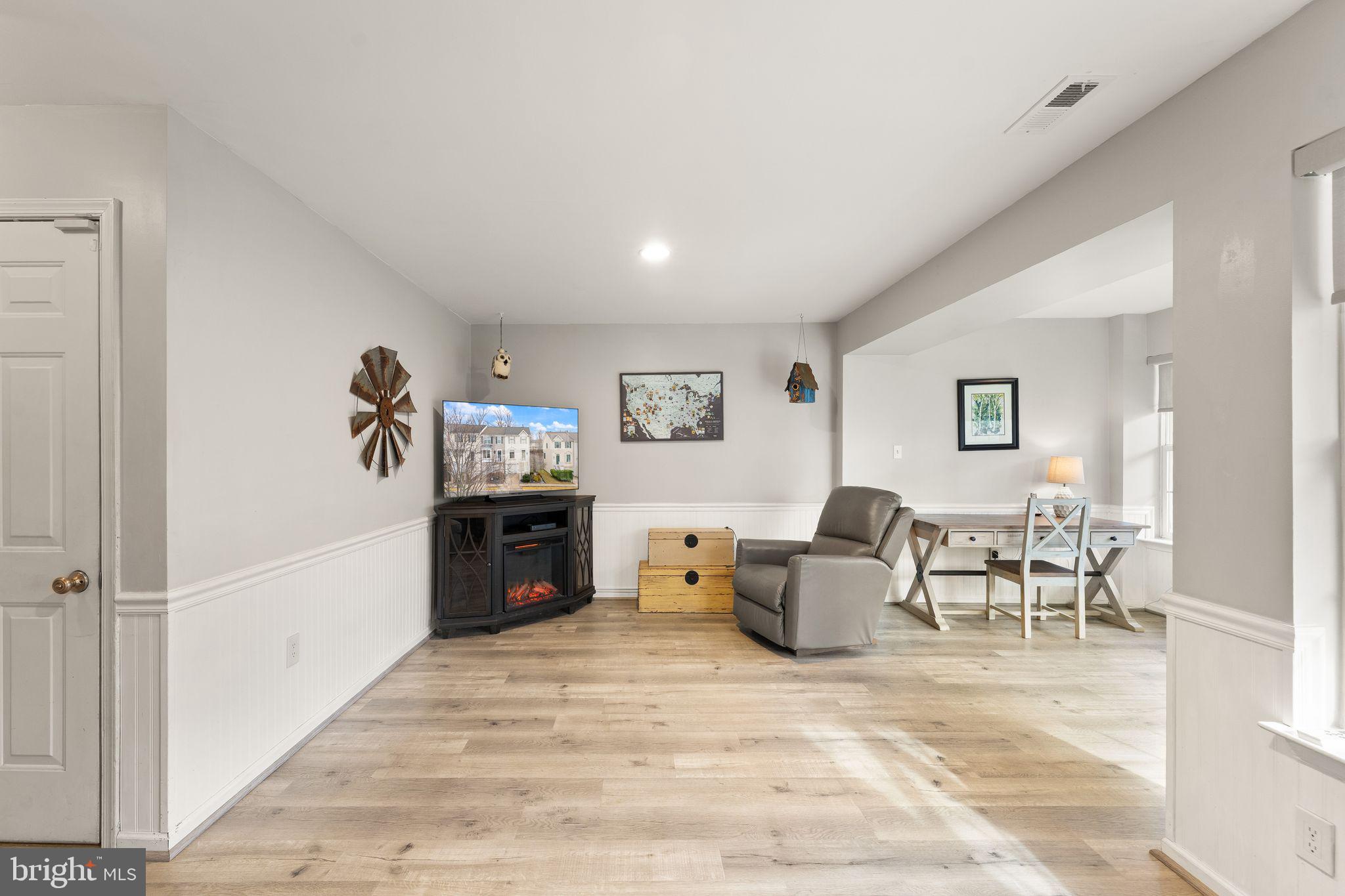 6377 St Timothys Lane Centreville, VA 20121 - Photo 46 of 58 a living room with furniture and a flat screen tv